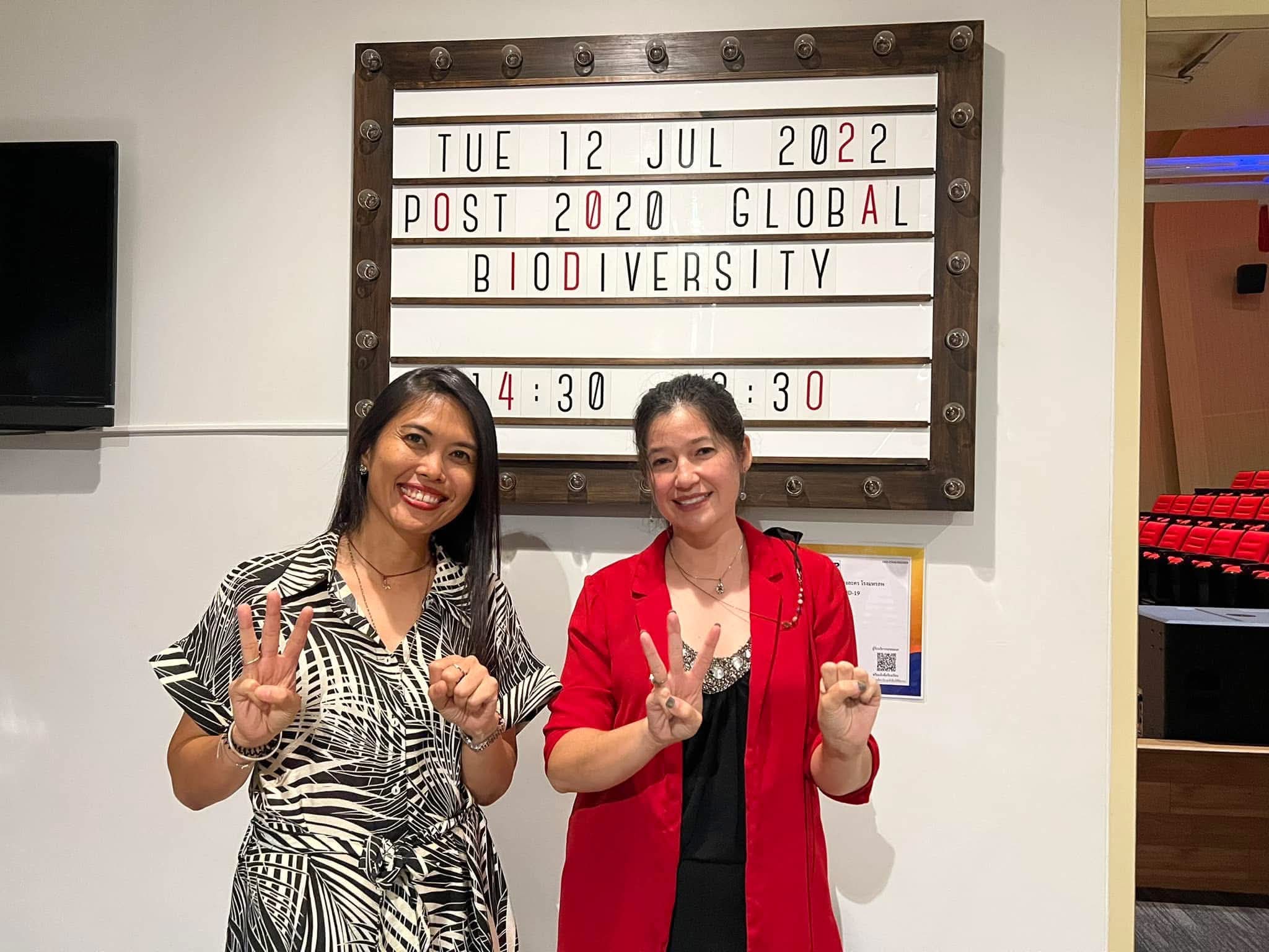 Siriporn Sriaram and Nancy Gibson in front of the event board for the Post-2020 Global Biodiversity dialogue on 12 July 2022
